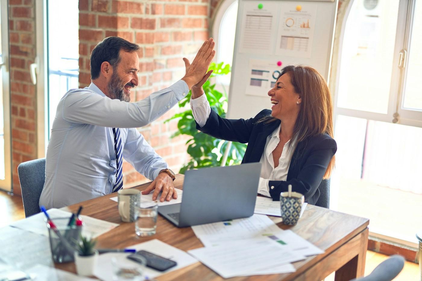 Business professionals in a modern office reviewing operational data together.
